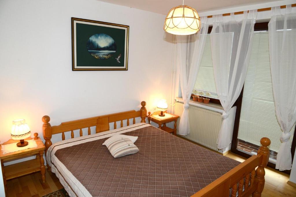 Postel nebo postele na pokoji v ubytování Apartmaji Rabič