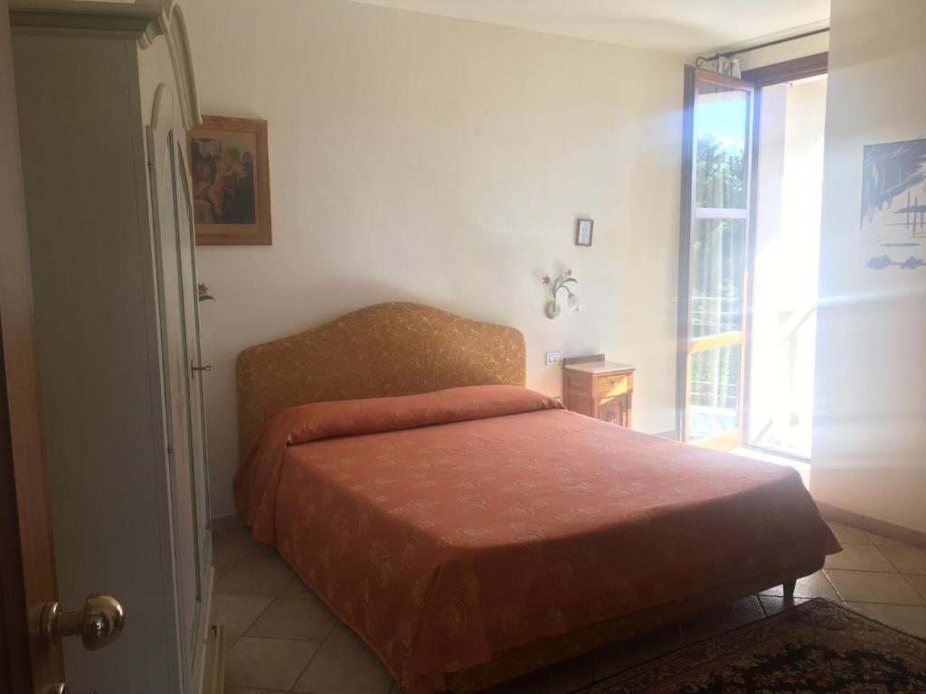 Postel nebo postele na pokoji v ubytování Villa Loreto