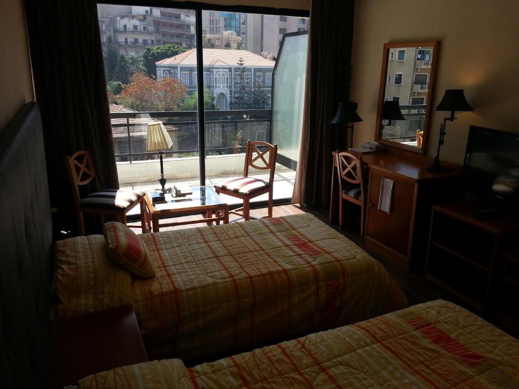 Postel nebo postele na pokoji v ubytování Charles Hotel