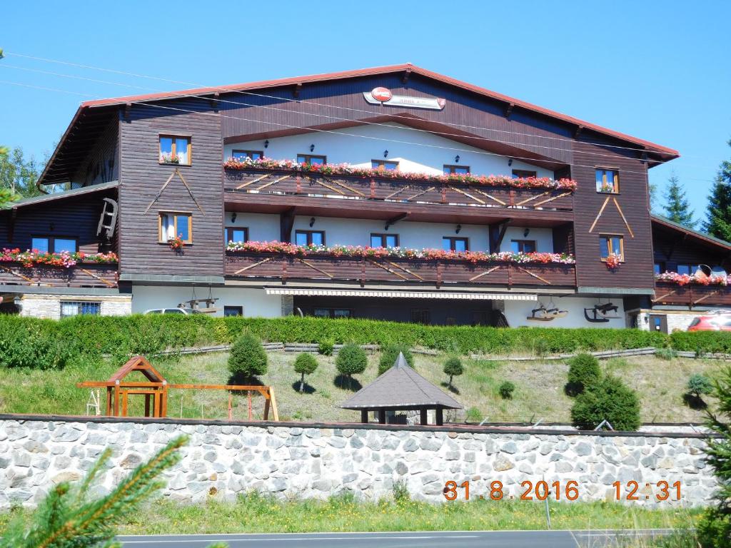 a large building on top of a hill at Pension H in Jáchymov