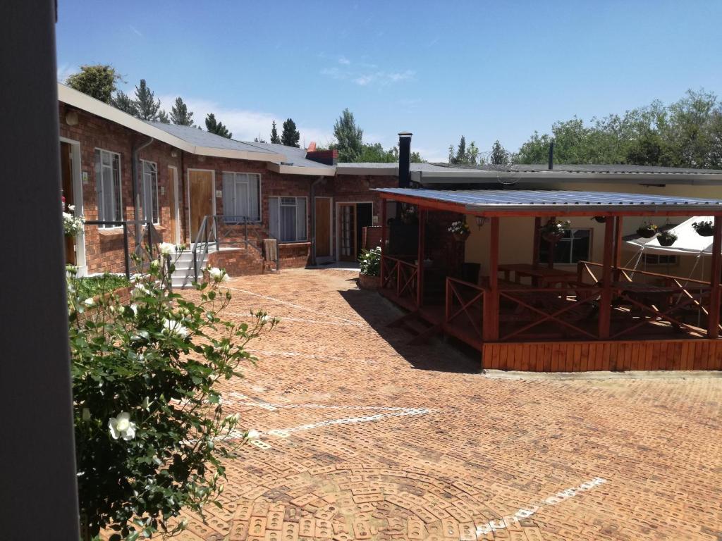 a group of buildings with a dirt yard at The Highland Inn in Bethlehem