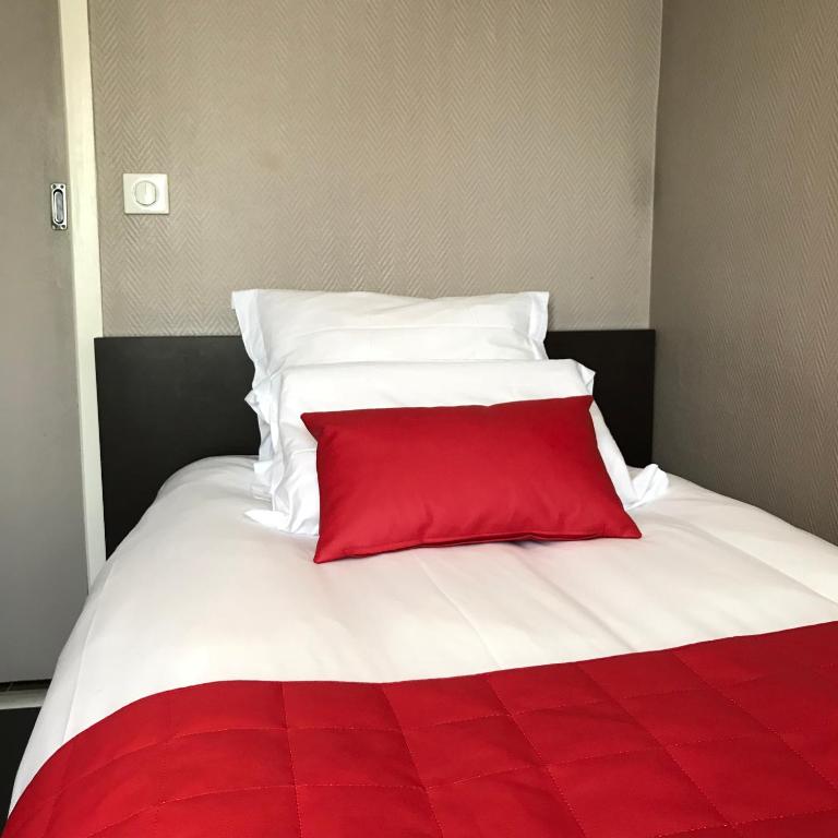 Postel nebo postele na pokoji v ubytování Hotel l'Avenue