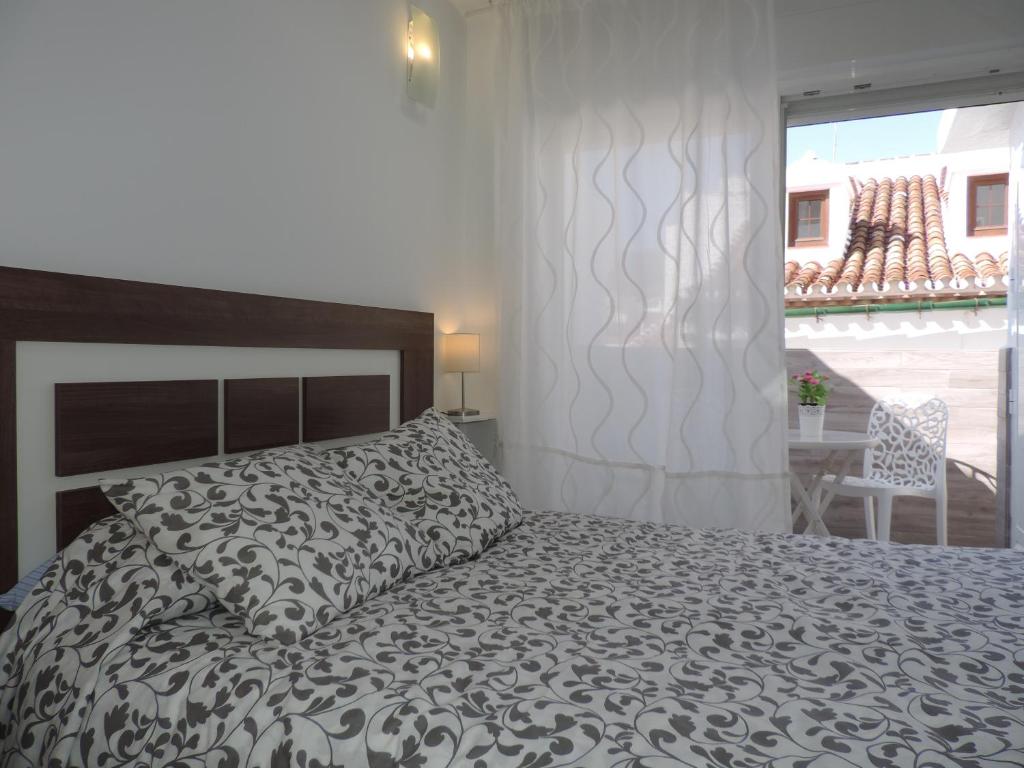 Postel nebo postele na pokoji v ubytování Casa las tres Conchas (2)