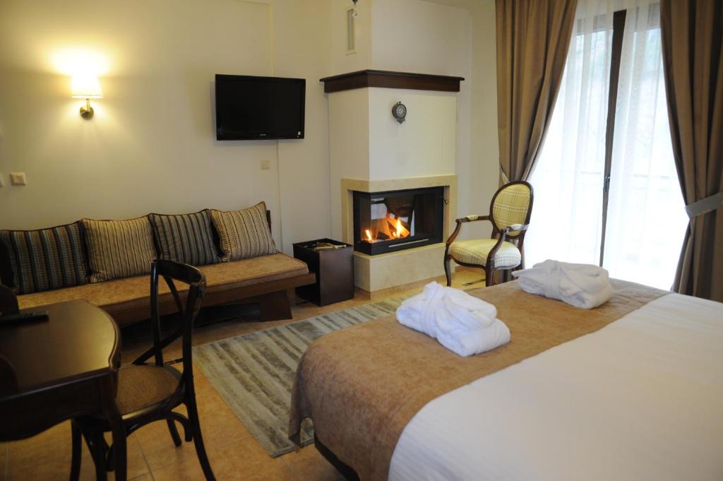 Postel nebo postele na pokoji v ubytování Agapi Luxury Hotel