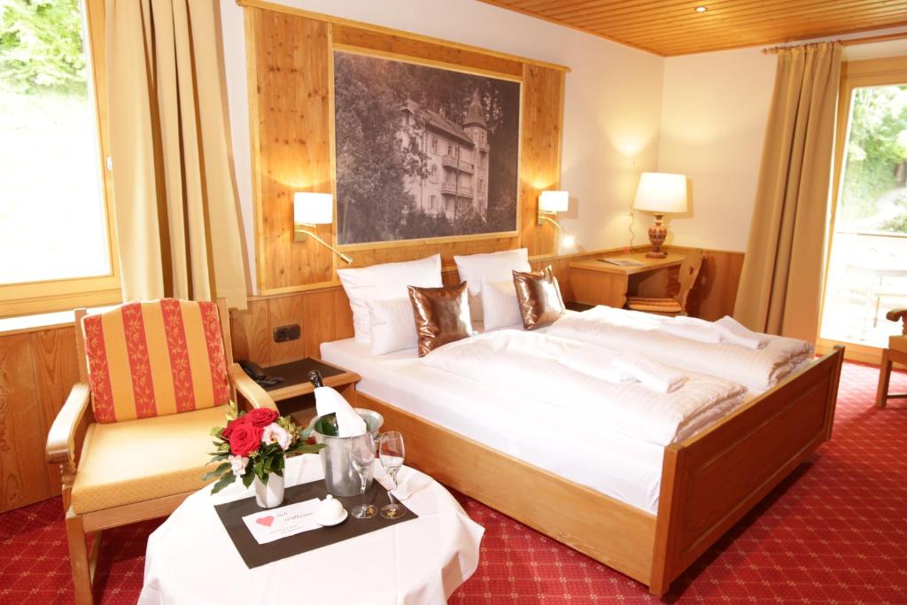 Postel nebo postele na pokoji v ubytování Hotel Strasser