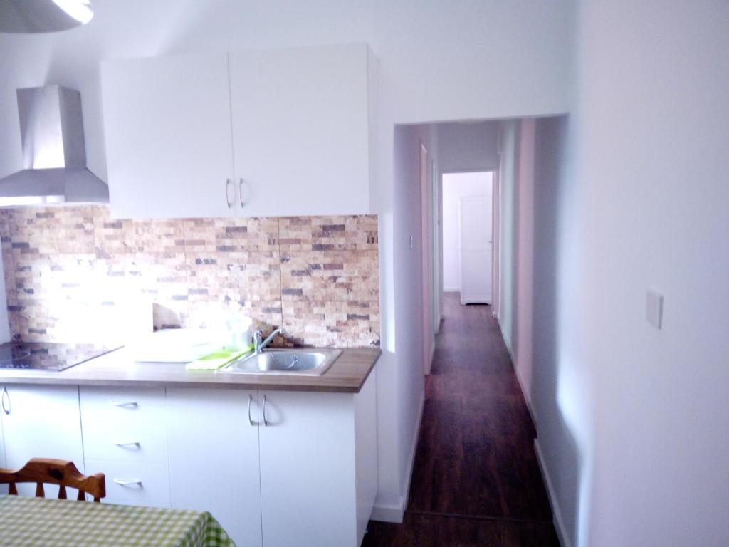 A kitchen or kitchenette at Apartamentos La Concepción