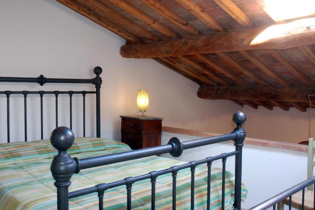 Postel nebo postele na pokoji v ubytování Agriturismo Olmi Grossi