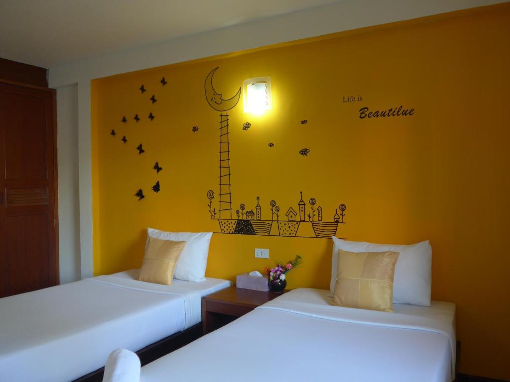 Postel nebo postele na pokoji v ubytování Forum House Hotel Krabi