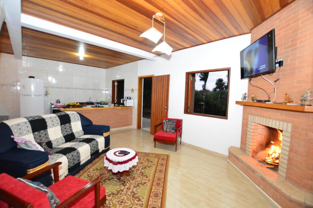 TV a/nebo společenská místnost v ubytování Pousada Florada do Amanhã
