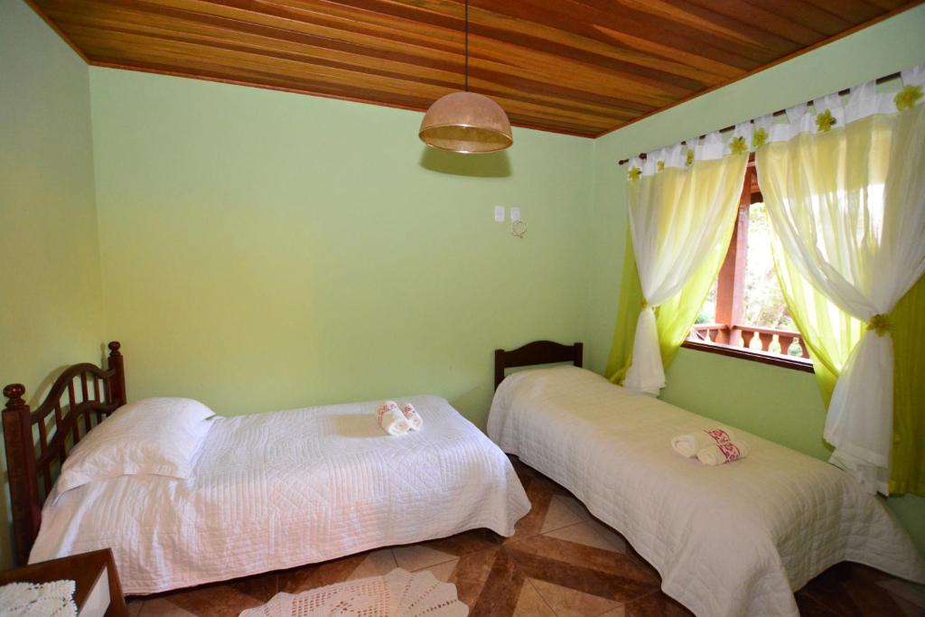 Postel nebo postele na pokoji v ubytování Pousada Florada do Amanhã