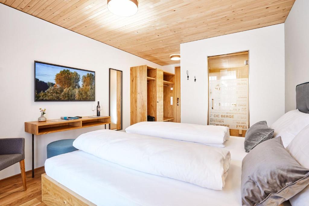 Postel nebo postele na pokoji v ubytování Hotel Gretina