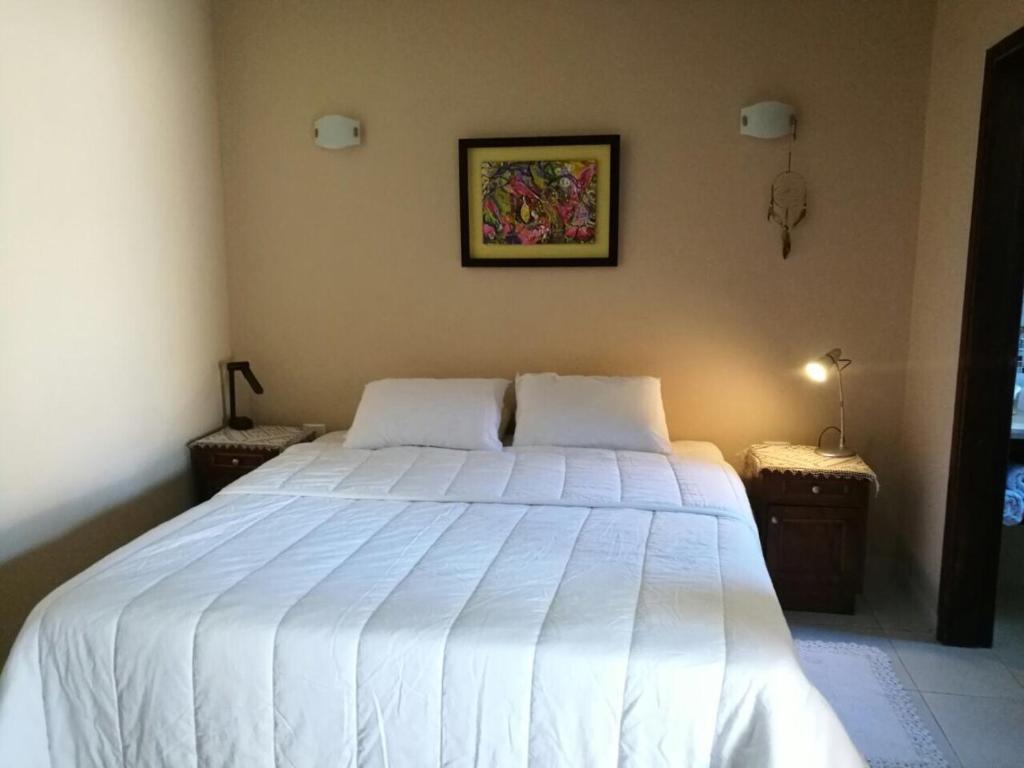 Voodi või voodid majutusasutuse Mandala Apartments toas