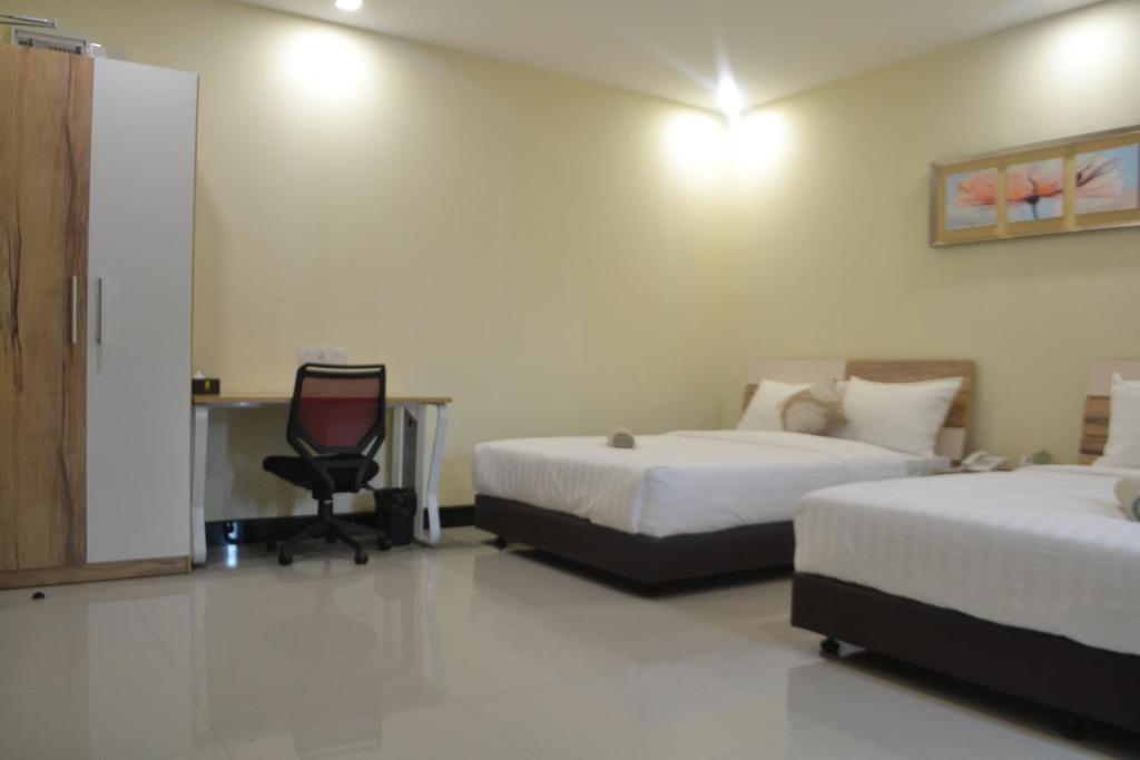 Postel nebo postele na pokoji v ubytování My Inn Hotel Kota Samarahan