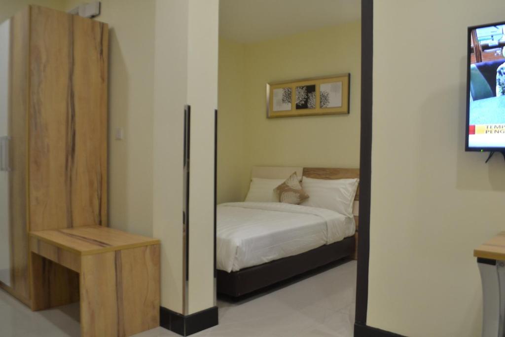 Postel nebo postele na pokoji v ubytování My Inn Hotel Kota Samarahan