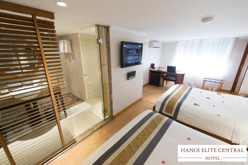 Postel nebo postele na pokoji v ubytování Elite Central Hotel Hanoi