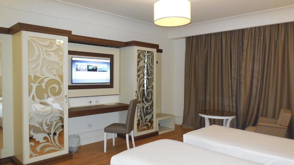 Postel nebo postele na pokoji v ubytování Hotel Marechiaro