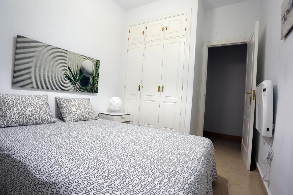 Posteľ alebo postele v izbe v ubytovaní Apartamento Duque de Arcos 2