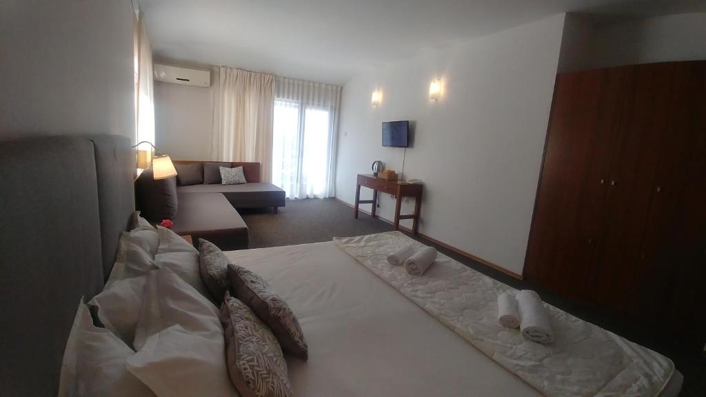 Postel nebo postele na pokoji v ubytování Family Hotel Muses