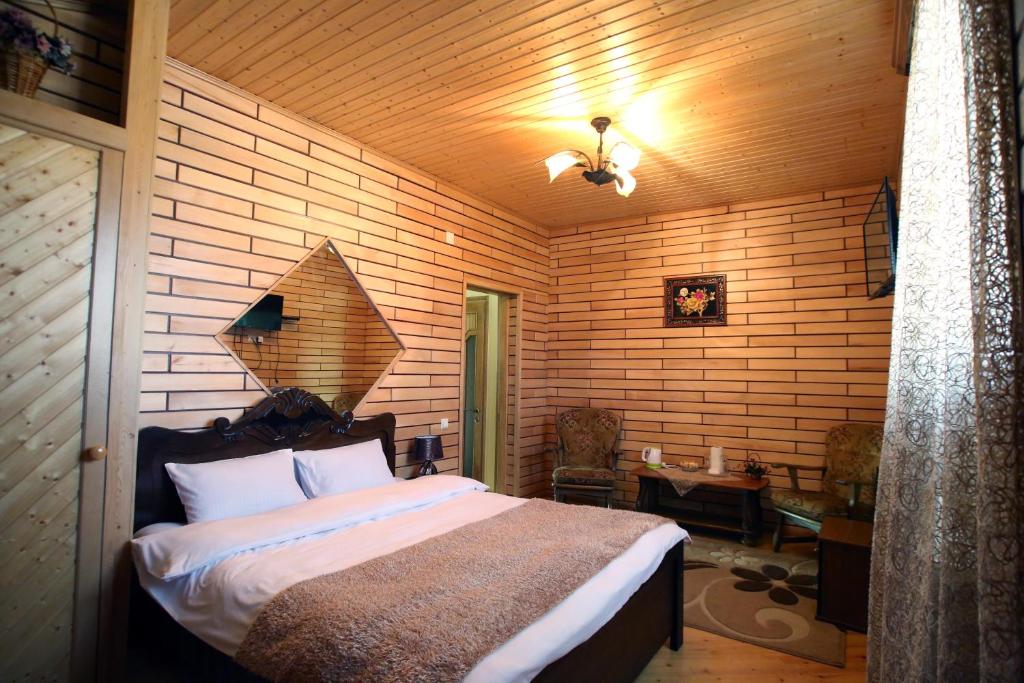 Postel nebo postele na pokoji v ubytování Hotel Harmony