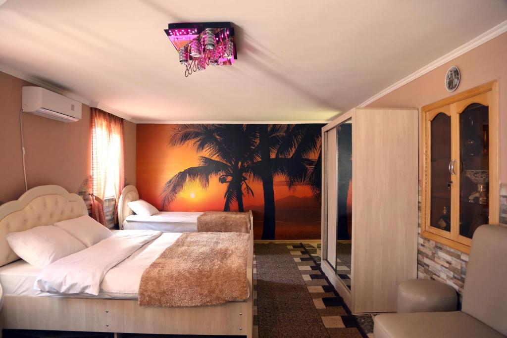 Postel nebo postele na pokoji v ubytování Hotel Harmony