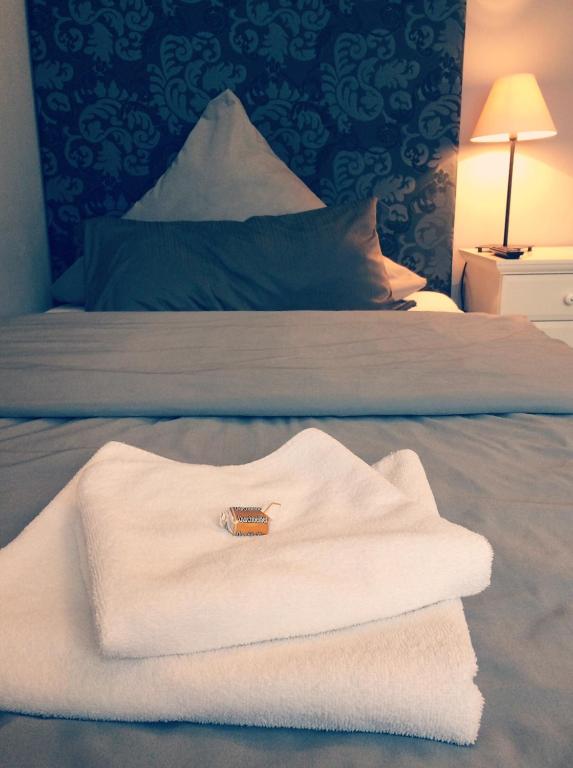 Postel nebo postele na pokoji v ubytování Hotel Heddernheimer Hof