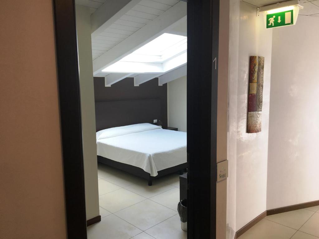 Postel nebo postele na pokoji v ubytování Residenza S.Event B&B