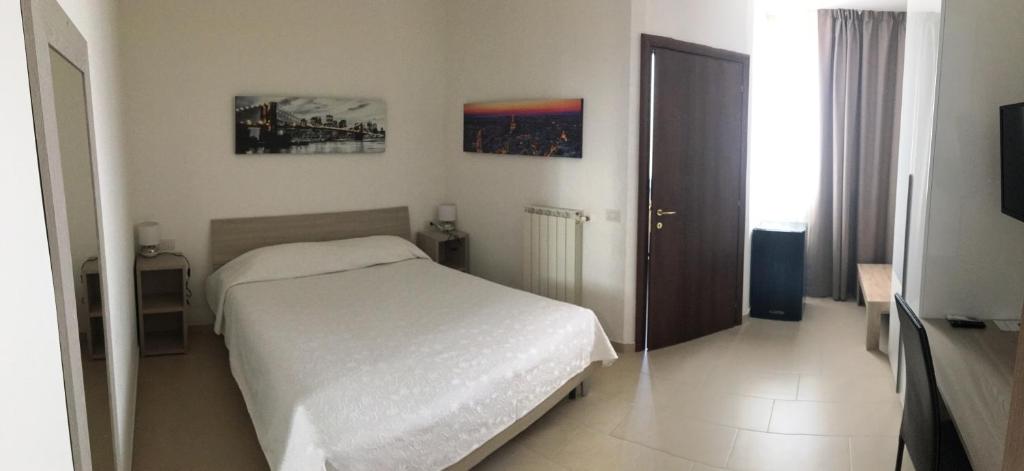 Postel nebo postele na pokoji v ubytování Residenza S.Event B&B