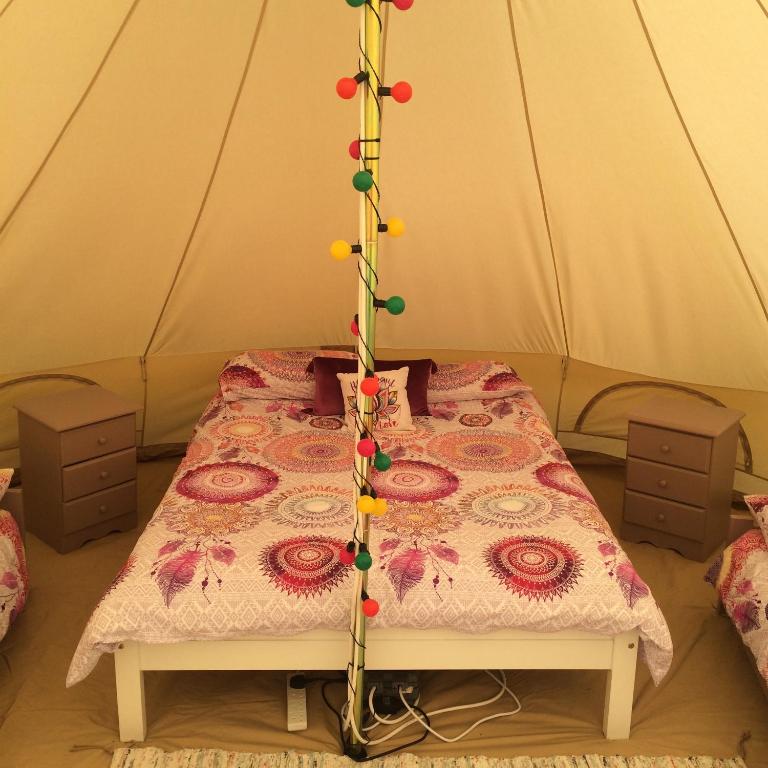 Postel nebo postele na pokoji v ubytování Cong Glamping