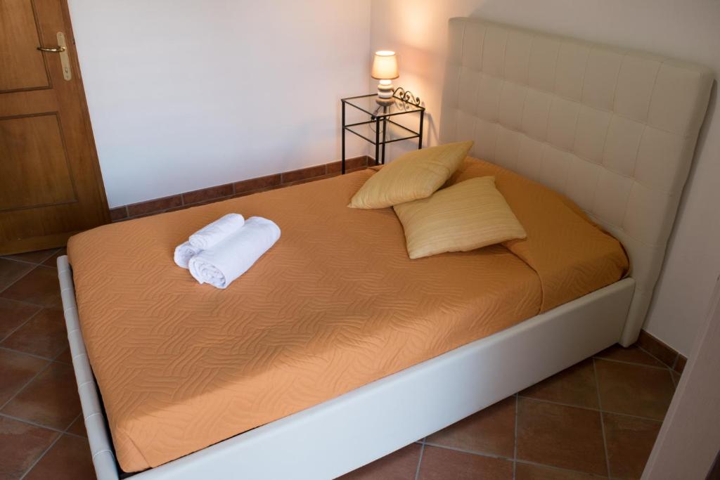 Postel nebo postele na pokoji v ubytování Residence Sant'Alessandro