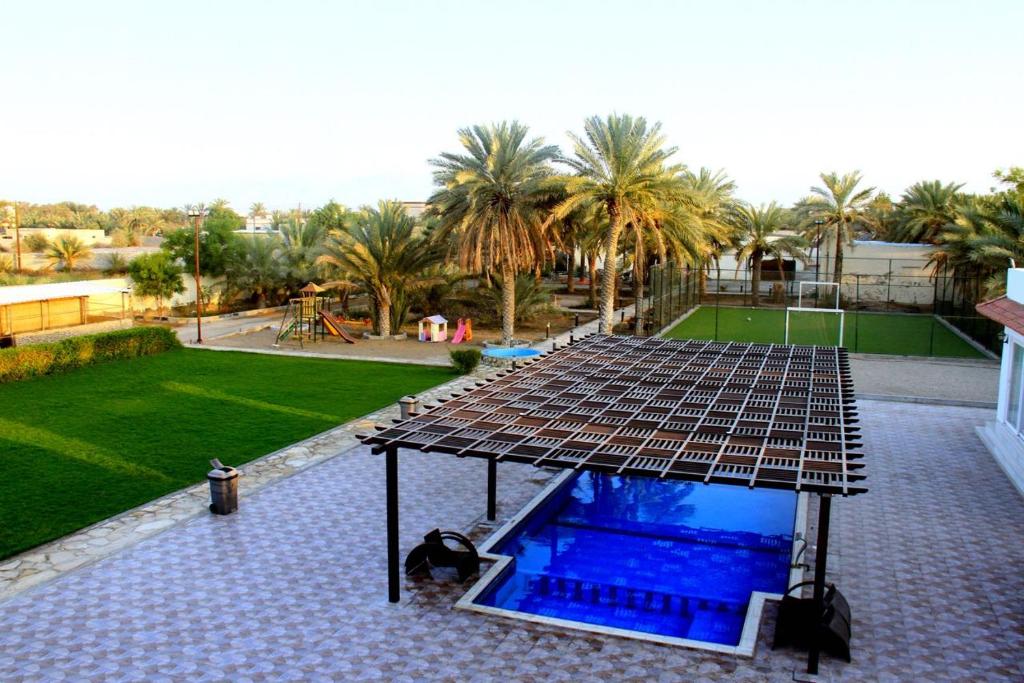 an overhead view of a swimming pool in a backyard at The Pearl Farm Chalet in Barka