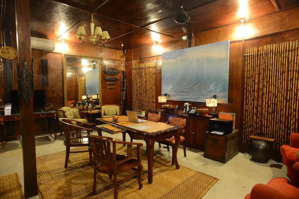a dining room with a table and chairs at Ombak Dive Resort Perhentian Island in Perhentian Islands