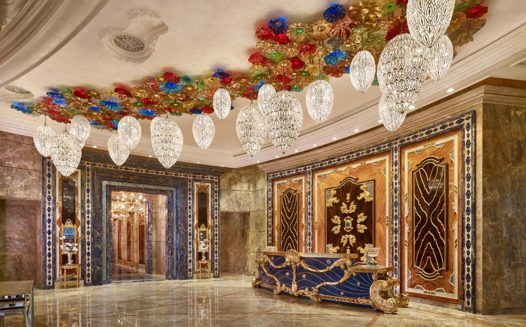 a room with chandeliers and a ceiling at The Reverie Saigon in Ho Chi Minh City