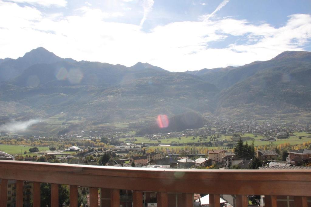a view of a valley with mountains in the background at Mon grenier in Aosta