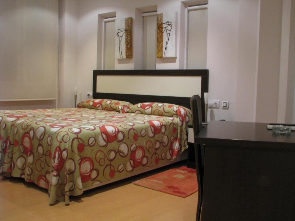 Postel nebo postele na pokoji v ubytování Hotel Elizalde