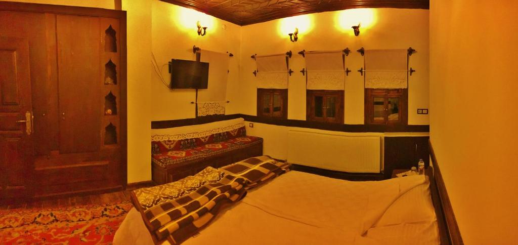 Postel nebo postele na pokoji v ubytování Beybagi Konak Hotel