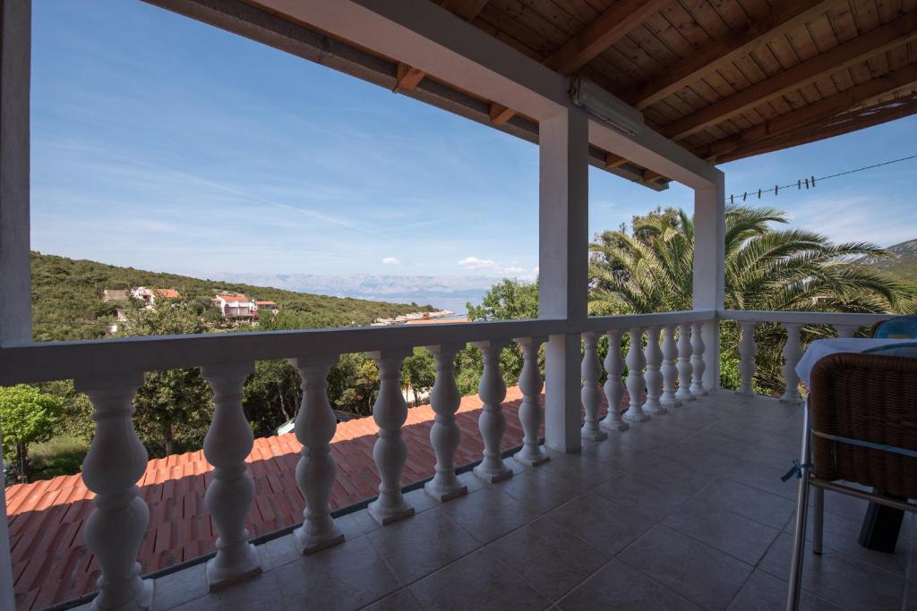 a balcony with a view of the mountains at Apartmani Marko in Gdinj