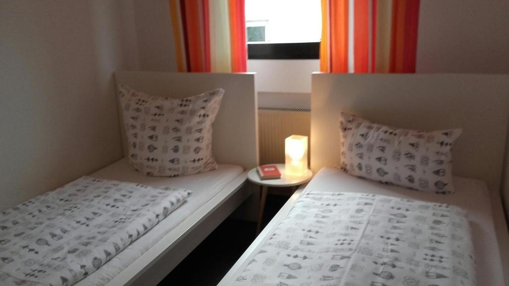 Postel nebo postele na pokoji v ubytování Gästehaus Moselblick