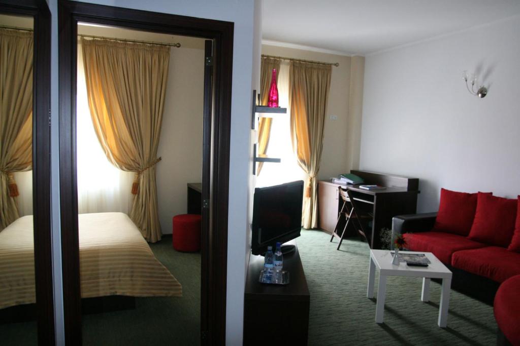 Postel nebo postele na pokoji v ubytování Hotel Kilometrul Zero