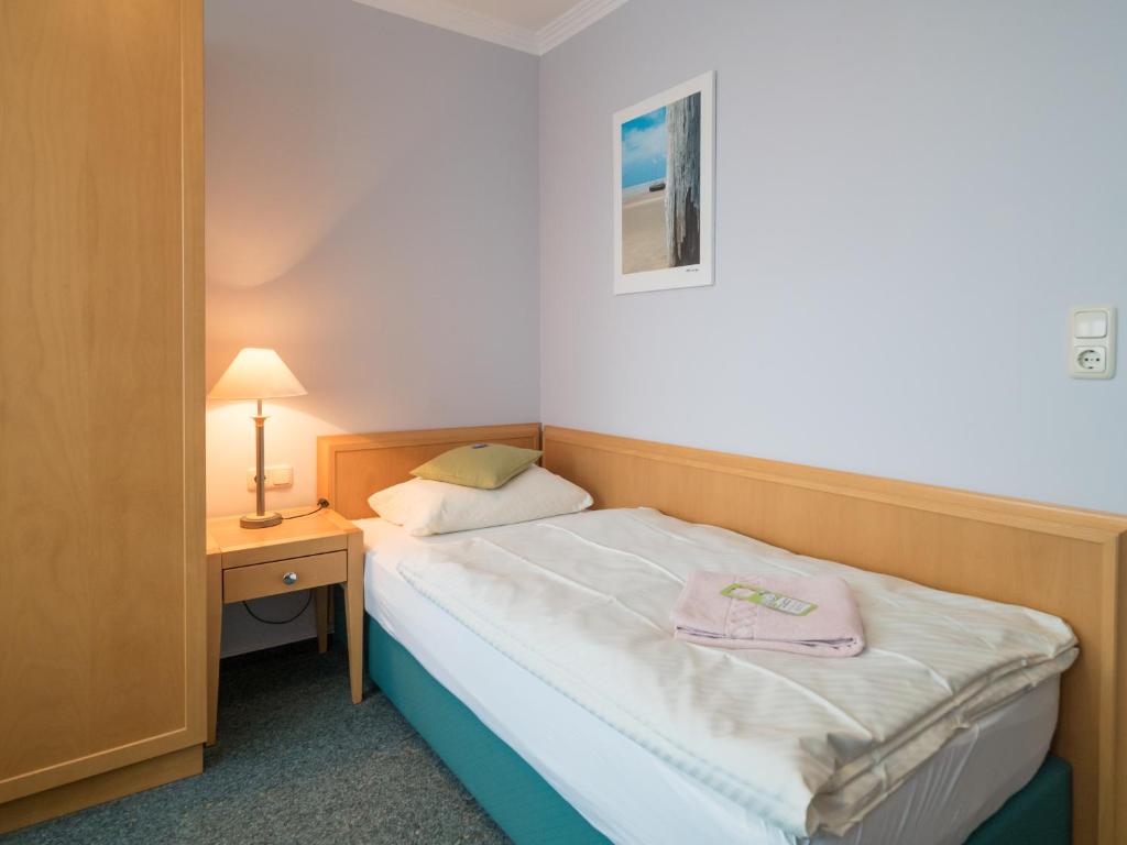 Postel nebo postele na pokoji v ubytování Hotel Spiekeroog