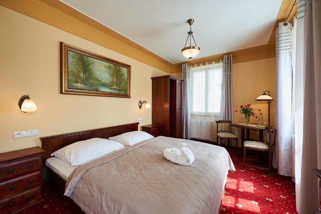 Кровать или кровати в номере Hotel Stará Pekárna s privátním wellness