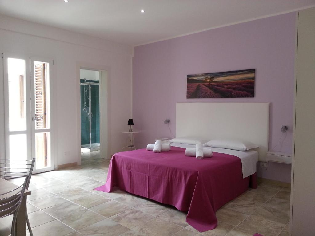 A bed or beds in a room at Holiday Homenza