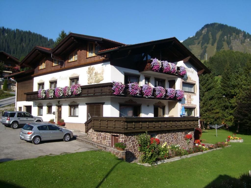 a house with flower boxes on the side of it at Appartements Birkenhof in Berwang