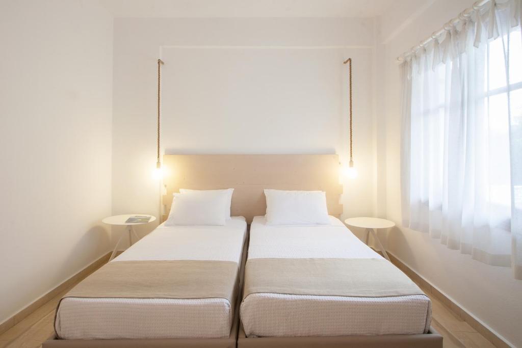 Un ou plusieurs lits dans un hébergement de l'établissement Paris Studios & Apartment