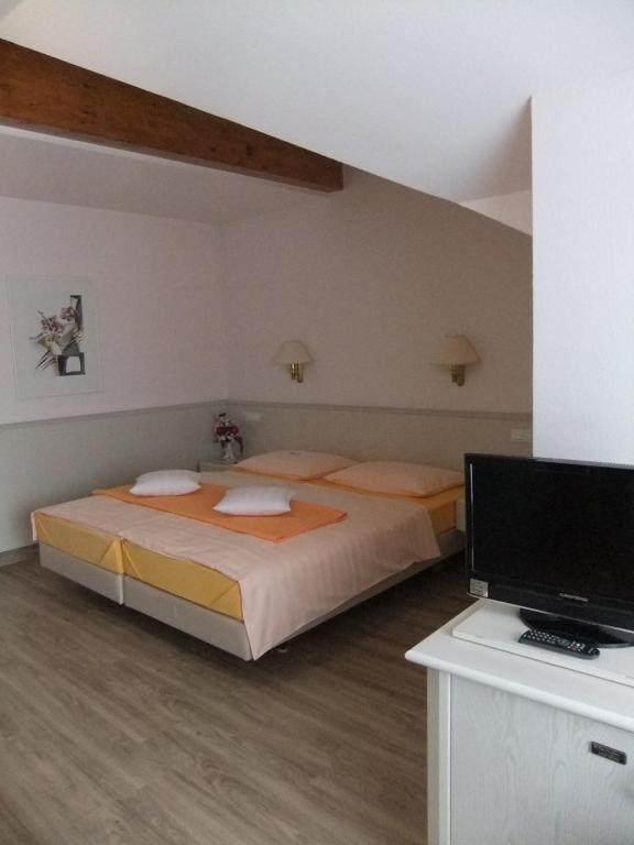 Postel nebo postele na pokoji v ubytování Hotel Garni Classico