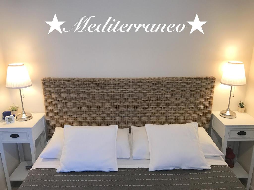 Postel nebo postele na pokoji v ubytování La Terra dei Mari Room & Relax