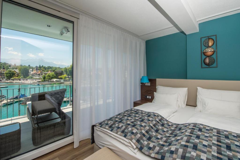 Postel nebo postele na pokoji v ubytování Boutiquehotel Wörthersee - Serviced Apartments