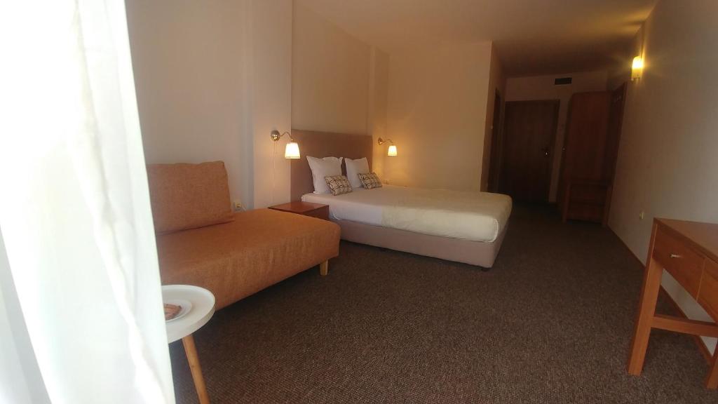 Postel nebo postele na pokoji v ubytování Family Hotel Muses