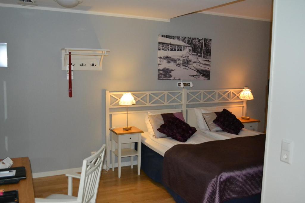 Postel nebo postele na pokoji v ubytování Hotell Nostalgi