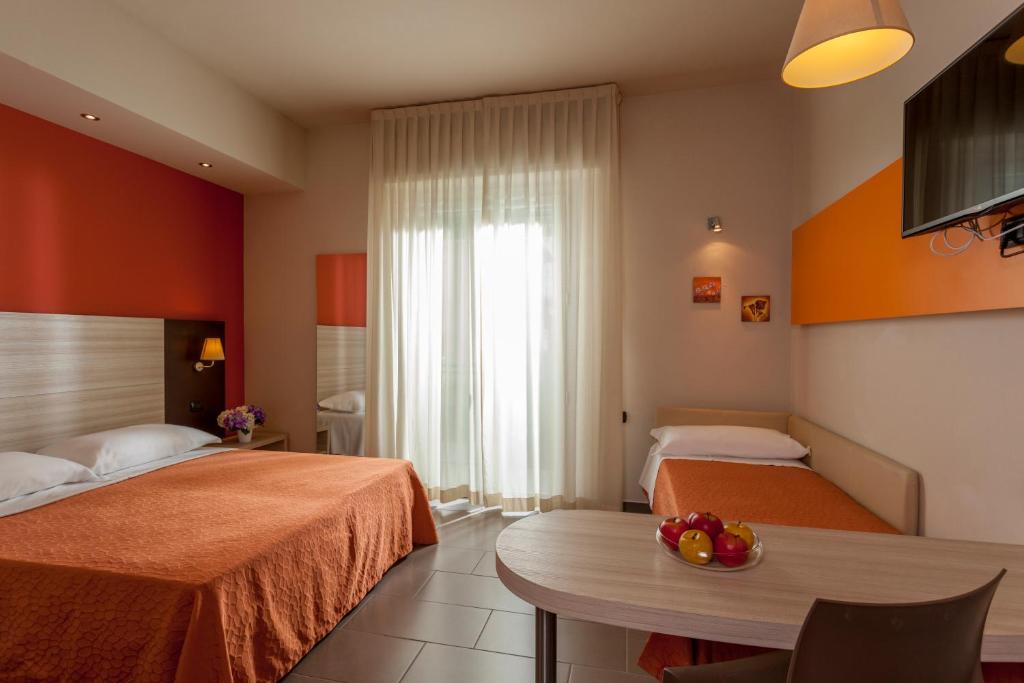 Postel nebo postele na pokoji v ubytování Hotel Aurora Mare