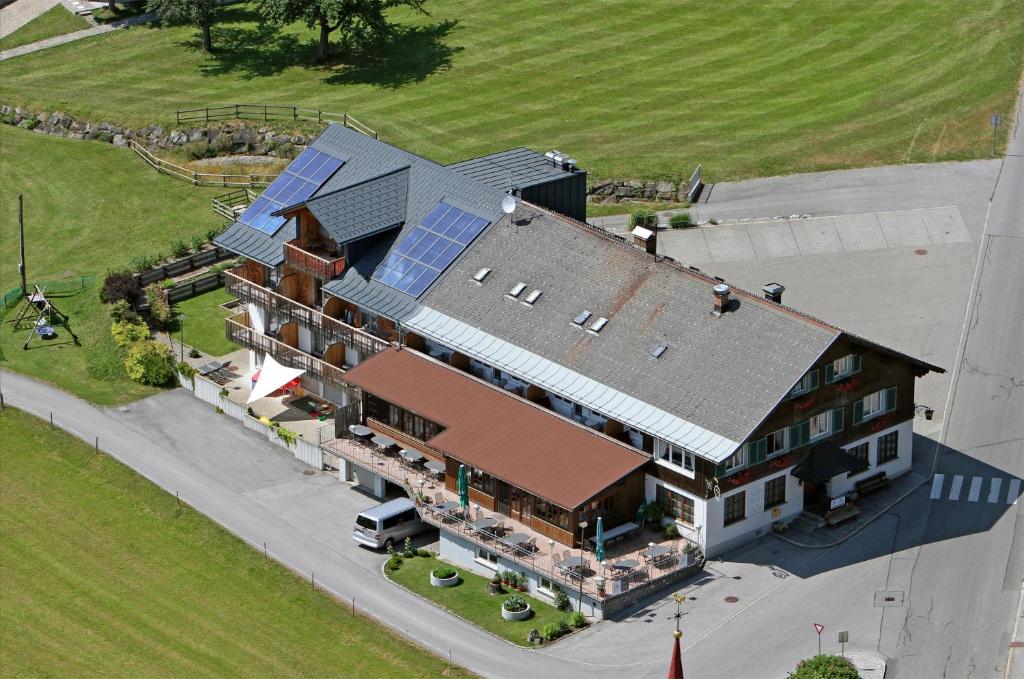 an aerial view of a house with a solar roof at Gasthof Hirschen in Sibratsgfäll